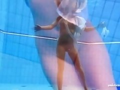 Big tits brunette babe Zuzanna swimming in the pool