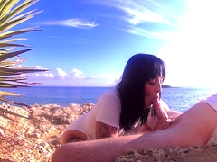 Naughty brunette reveals her blowjob talents on the beach